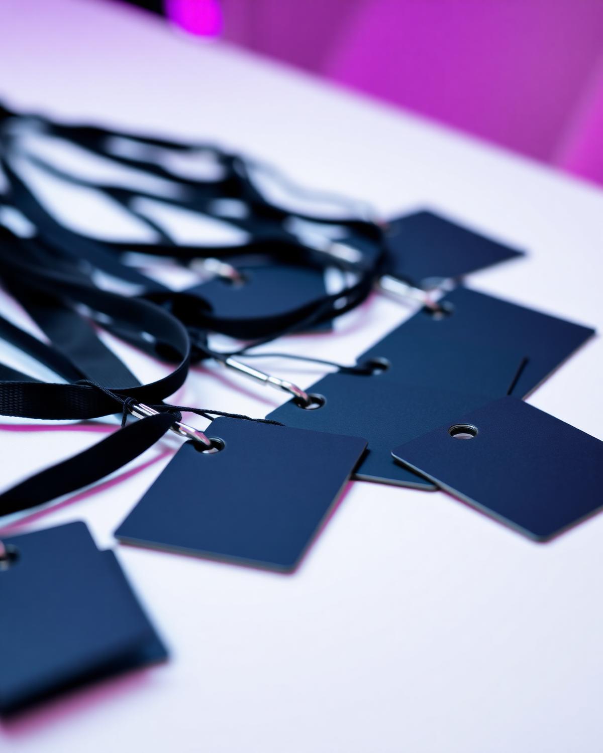 Credentials and lanyards laid out at the registration desk